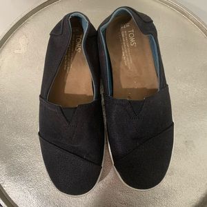 Toms black slip-ons